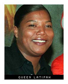 Rap Artist Queen Latifah, left, poses for photographers at the Virgin Superstore in New York, Monday, June 15, 1998. She was there with rapper Lil Nique, right, to promote her new release "Order in the Court." (AP Photo/Tom Zuback) (Associated Press)