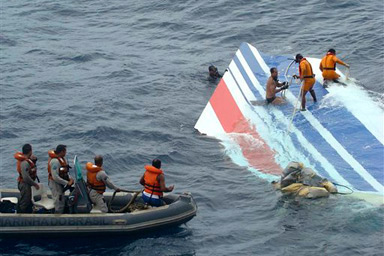 In this photo released by Brazil's Air Force, Brazil's Navy sailors recover debris from the missing Air France jet at the Atlantic Ocean, Monday, June 8, 2009.  A U.S. Navy team was flying to Brazil on Monday with high-tech underwater listening devices to help the search for the black boxes from an Air France plane that crashed into the Atlantic Ocean.