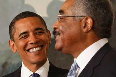 U.S. President Barack Obama (L) smiles as he is introduced to speak about the agreement to lower drug costs for seniors by Barry Rand, the CEO of AARP, in the Diplomatic Reception Room of the White House in Washington June 22, 2009.