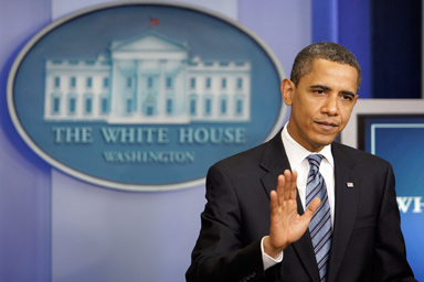 President Barack Obama pauses as he talks to the media in the briefing room at the White House in Washington, Friday, July 24, 2009.