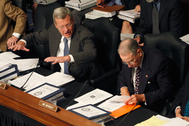 Senate Finance Committee Chairman Sen. Max Baucus, D-Mont. left, makes a point on Capitol Hill in Washington, Wednesday, Sept. 23,2009, and the committee continued working on health care legislation. The committee's ranking Republican Sen. Charles Grassley, R-Iowa is at right.