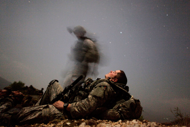 A U.S. soldier of 2-12 Infantry 4BCT-4ID Task Force Mountain Warrior takes a break during a night mission near Honaker Miracle camp at the Pesh valley of Kunar Province August 12, 2009.