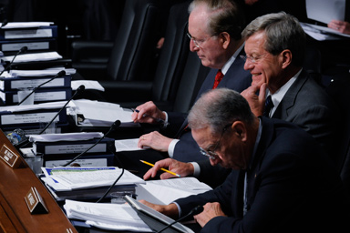 Senate Finance Committee Chairman Sen. Max Baucus, D-Mont., center, takes part in the markup of health care legislation, Tuesday, Sept. 22, 2009, on Capitol Hill in Washington. From left are, Sen. Jay Rockefeller, D-W.Va., Baucus, and the committee's ranking Republican Sen. Charles Grassley, R-Iowa.