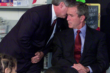 In this Sept. 11, 2001 file photo, President Bush's Chief of Staff Andy Card whispers into the ear of the President to give him word of the plane crashes into the World Trade Center, during a visit to the Emma E. Booker Elementary School in Sarasota, Fla.