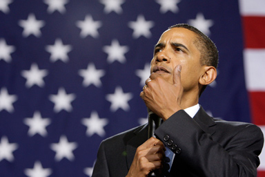 President Barack Obama listens to a question during a town hall meeting on health care reform, Tuesday, Aug. 11, 2009, at Portsmouth High School in Portsmouth, N.H.