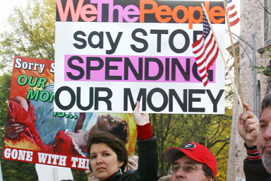 Gina Vaughn of Acworth, GA makes her opinion known as she stands on the barrier at the Atlanta Tea Party, Wednesday, April 15, 2009