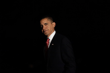 President Barack Obama walks across the South Lawn of the White House during his arrival on Marine One helicopter in Washington, Tuesday, Oct. 20, 2009.