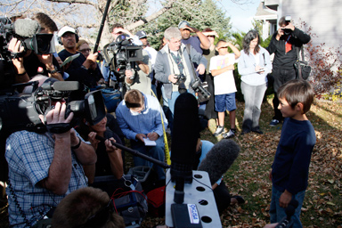 Six-year-old Falcon Heene is surrounded by reporters on the lawn of his house in Fort Collins, Colorado October 15, 2009.