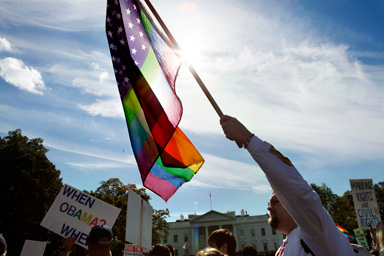 Thousands of gay rights advocates march past the White House during the National Equality March in Washington, on Sunday, Oct. 11, 2009.