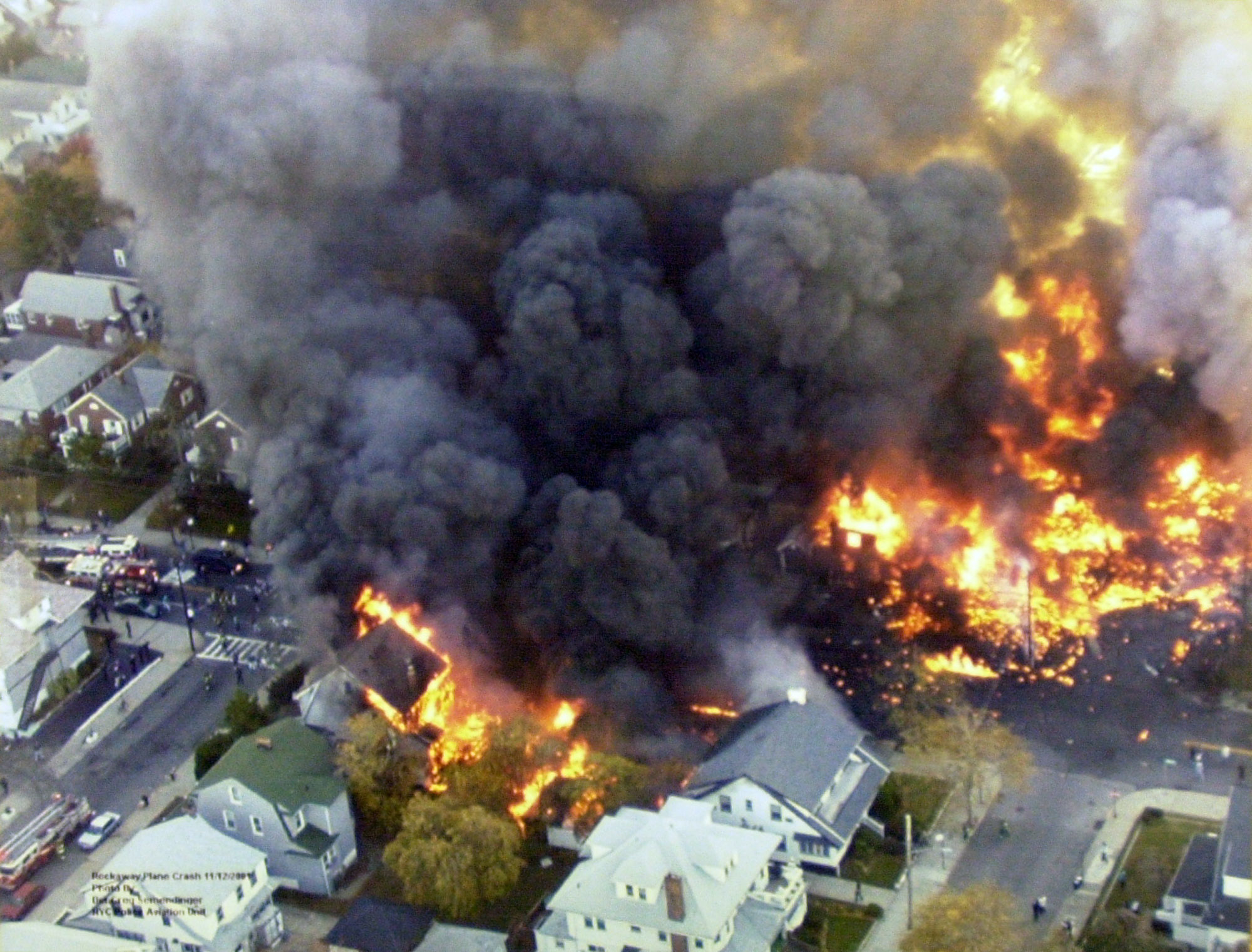Fires burning in New York's Belle Harbor neighborhood, from the crash of American Airlines Flight 587 which killed 265 people, are visible from a police helicopter Monday, Nov. 12, 2001. (AP Photo/New York Police Department) (Associated Press)