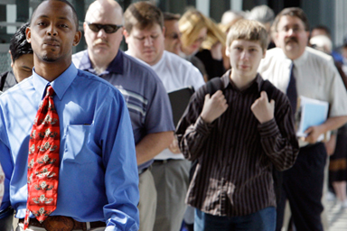 People wait in line to enter a job fair in Seattle on June 16.