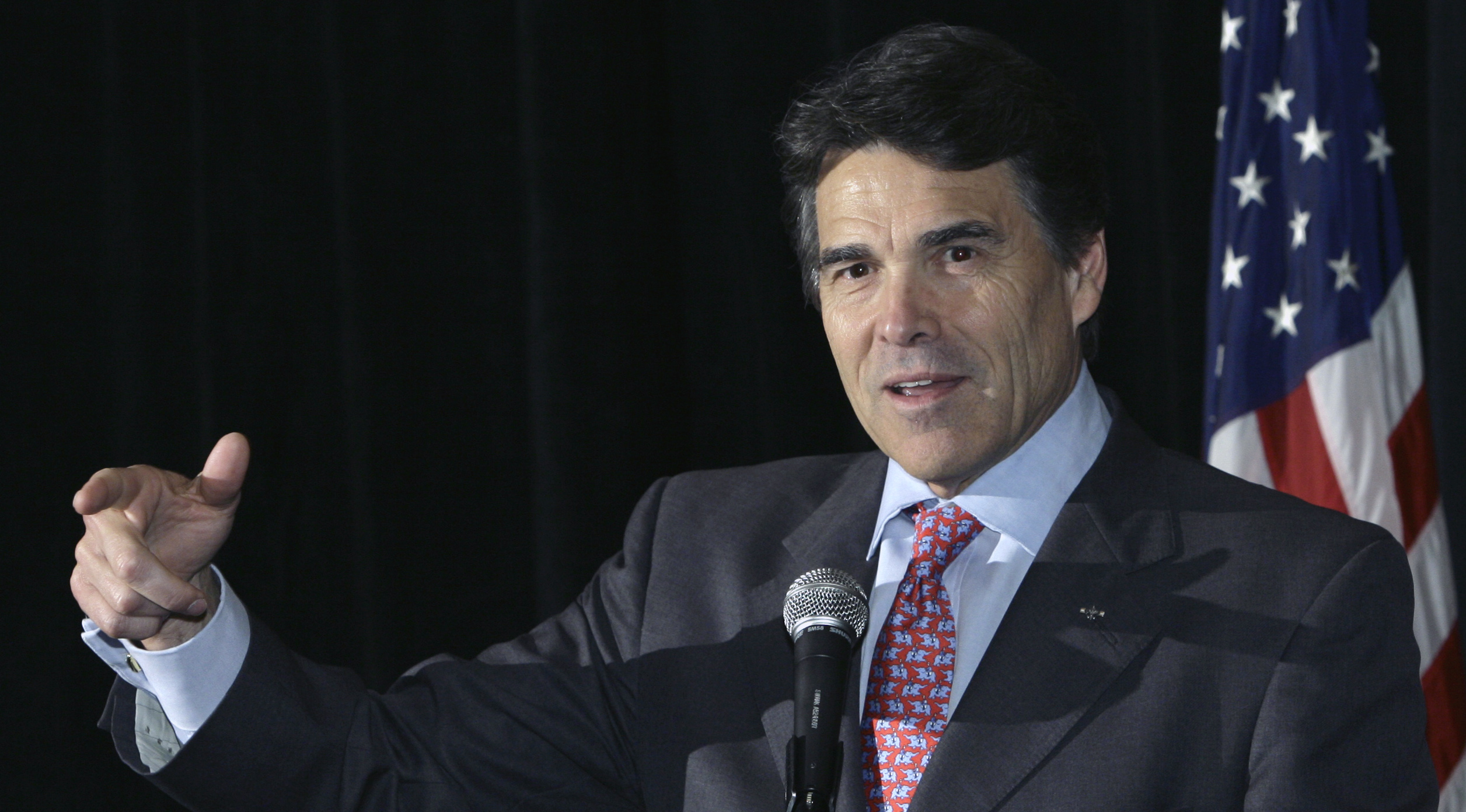 Texas Gov. Rick Perry speaks to a Texas Workforce Commission conference Wednesday, April 22, 2009, in Austin, Texas. Perry, who rejected $550 million in federal stimulus money for the state's unemployment fund despite lawmakers' objections, spoke to the group, where stimulus dollars were the topic of the day.    (AP Photo/Harry Cabluck) (Harry Cabluck)