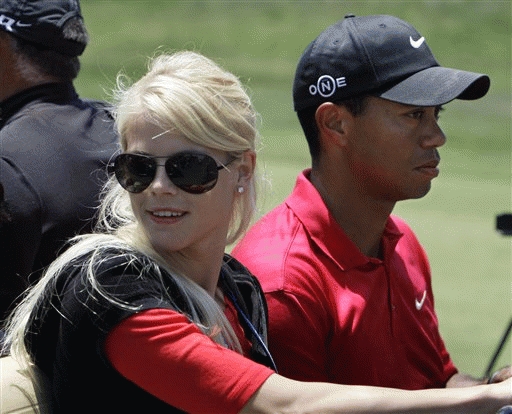 FILE - Tiger Woods' wife, Elin Nordegren, rides next to Woods after winning the US Open championship at Torrey Pines Golf Course on  June 16, 2008.