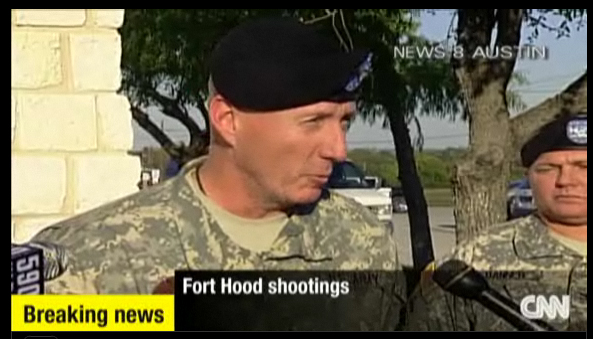 An army official holds a press briefing on the shooting at Fort Hood