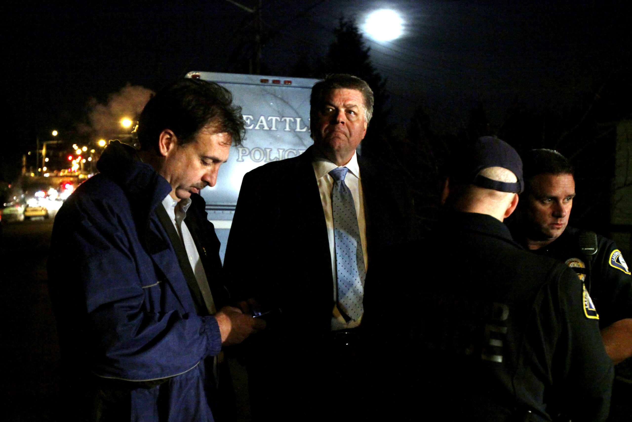 Lakewood Police chief Bret Farrer frowns as he listens to a news briefing with Ed Troyer, a spokesman for the Pierce County sheriff,  and Lakewood police officers near where a man suspected of gunning down four police officers earlier in the week was shot and killed by a lone Seattle patrol officer Tuesday, Dec. 1, 2009, in Seattle.
Four other people were arrested for allegedly helping the suspect elude authorities during a massive two-day manhunt. A Seattle police officer came across the stolen car in a working-class south Seattle neighborhood about 2:45 a.m., Assistant Police Chief Jim Pugel said. The officer approached the car, then detected movement behind him, recognized the suspect Maurice Clemmons and ordered him to show his hands and stop. (AP Photo/Elaine Thompson) (Elaine Thompson)