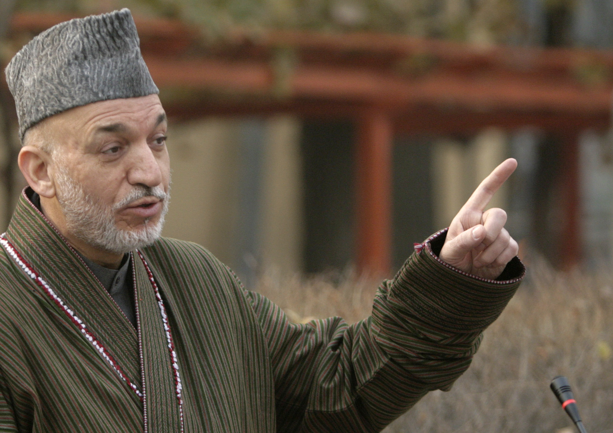 Afghanistan President, Hamid Karzai, addresses the media on the occasion of Eid al-Adha, at the Presidential Palace mosque in Kabul, Afghanistan, Friday, Nov. 27, 2009. In his message to mark the major Muslim holiday of Eid, Karzai said that "all our ... brothers who stand armed against their country," including the militant Islamic faction Hezb-e-Islami led by warlord Gulbuddin Hekmatyar, should help ensure stability and development in Afghanistan. (AP Photo/Mustafa Quraishi) (Mustafa Quraishi)