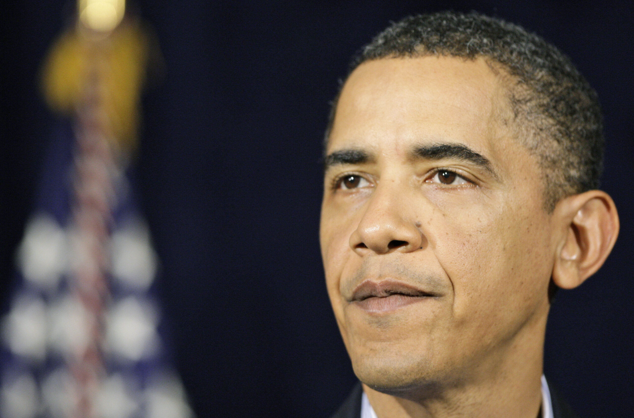President Barack Obama pauses while speaking at the Marine Corps Base Hawaii in Kaneohe Bay, Hawaii Tuesday, Dec. 29, 2009. (AP Photo/Alex Brandon) (Associated Press)