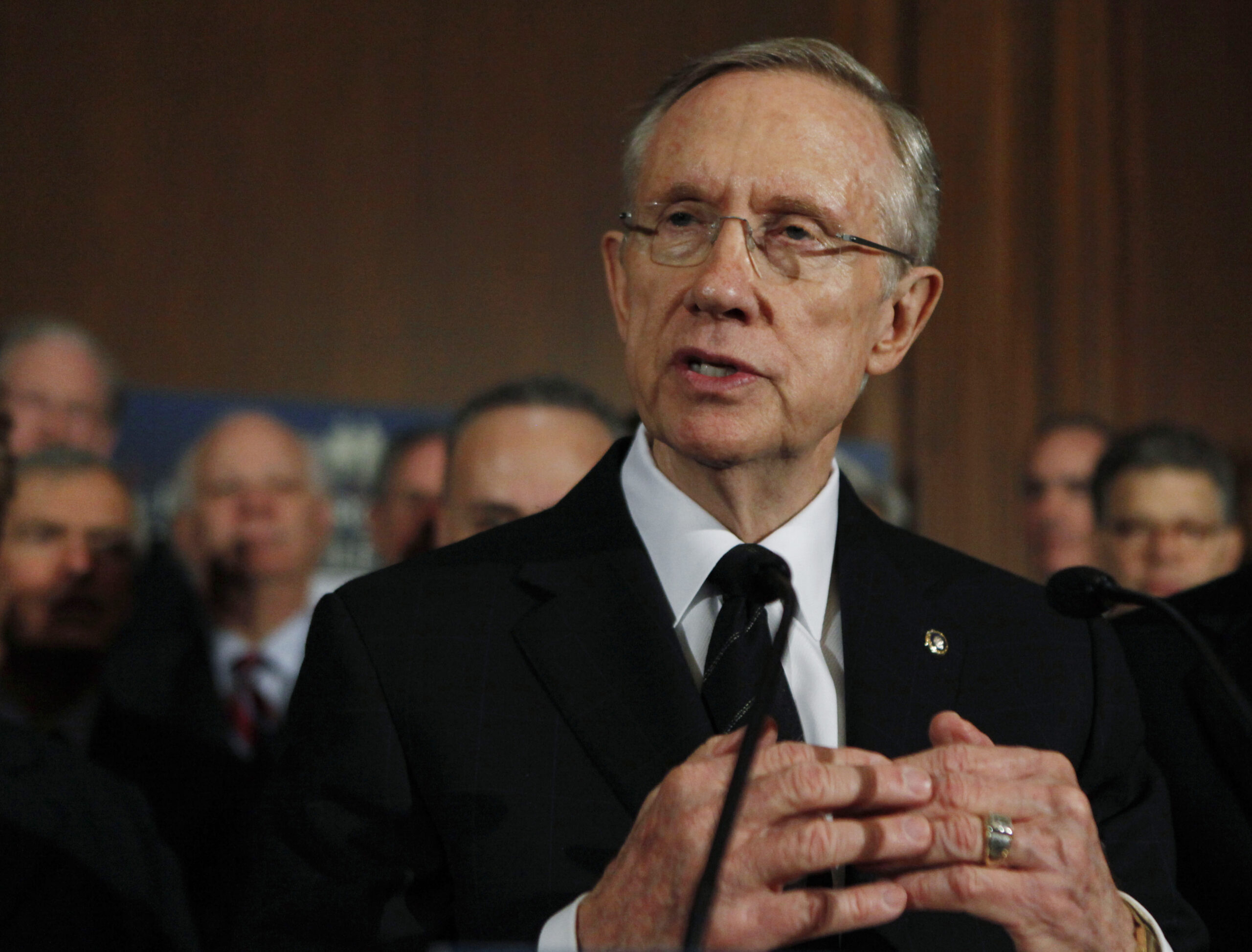 Senate Majority Leader Sen. Harry Reid of Nev., accompanied by Senate Democrats, gestures during a health care news conference on Capitol Hill in Washington, Wednesday, Dec. 23, 2009.   (AP Photo/Manuel Balce Ceneta) (Associated Press)