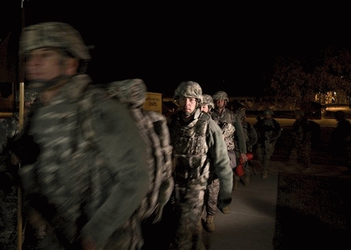 The 467th Medical Detachment based out of Madison, WI,  prepare to head to the airport for their deployment to Afghanistan at Fort Hood, Texas, Friday, Dec. 4, 2009.
