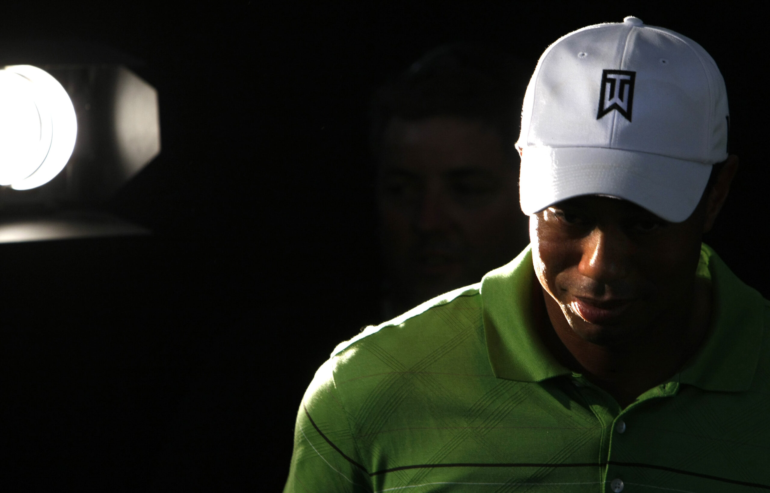 Tiger Woods of the U.S. leaves a news conference ahead of this weeks' Australian Masters golf tournament in Melbourne November 10, 2009. REUTERS/Mick Tsikas   (AUSTRALIA SPORT GOLF) (Reuters)