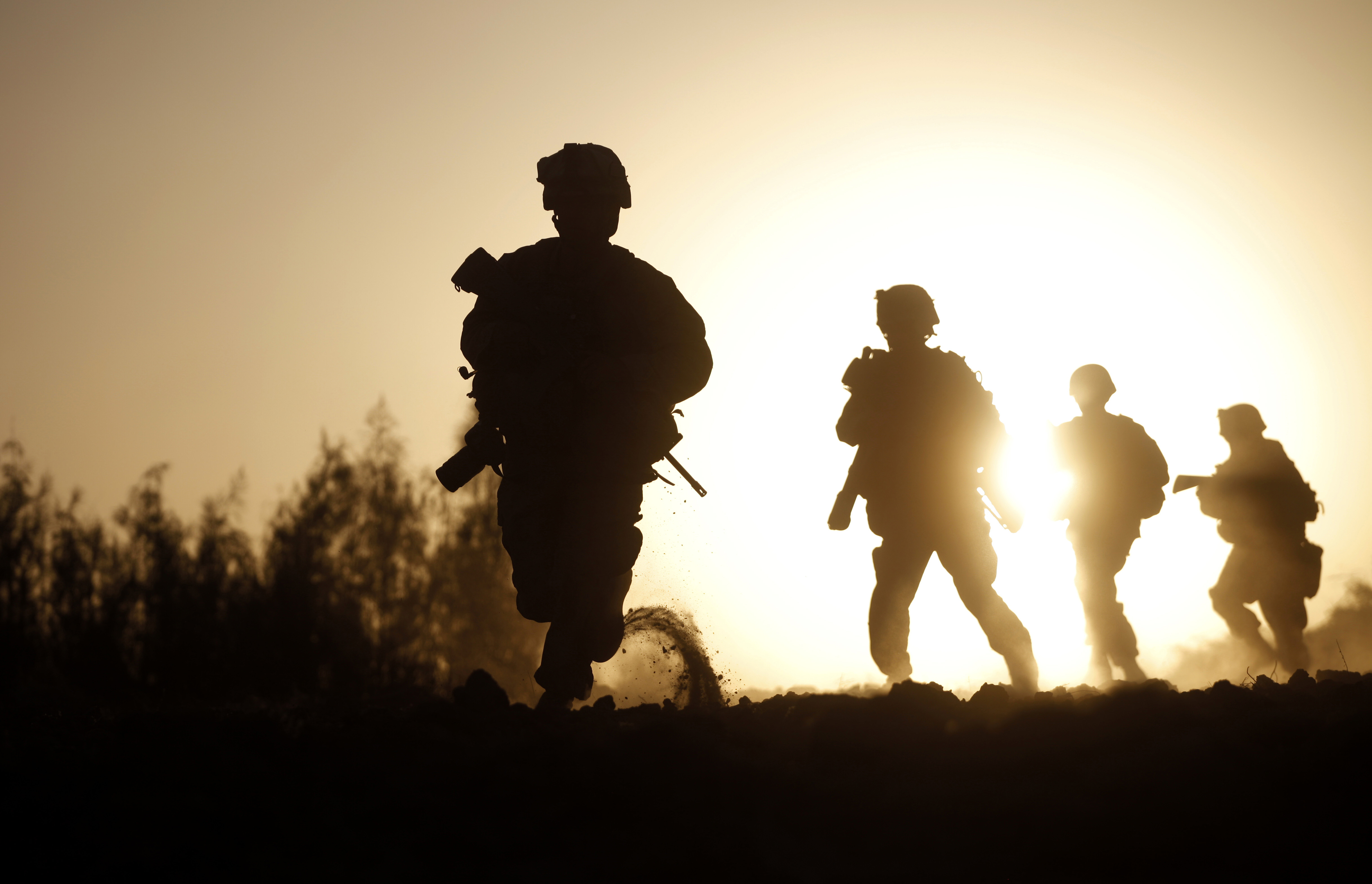 U.S. Marines with 3rd Platoon, Bravo Company, 1st Battalion 5th Marines, run for new cover after it appeared the Taliban was zeroing in on their position, in Nawa district, Helmand province, southern Afghanistan, Friday, Oct. 2, 2009. The fight, which began when Taliban fighters opened up with assault rifles and machine guns on a Marine patrol over open ground, lasted around 2 hours, and ended with no casualties among the Marines and an unknown number of Taliban wounded or killed. (AP Photo/Brennan Linsley) (Associated Press)