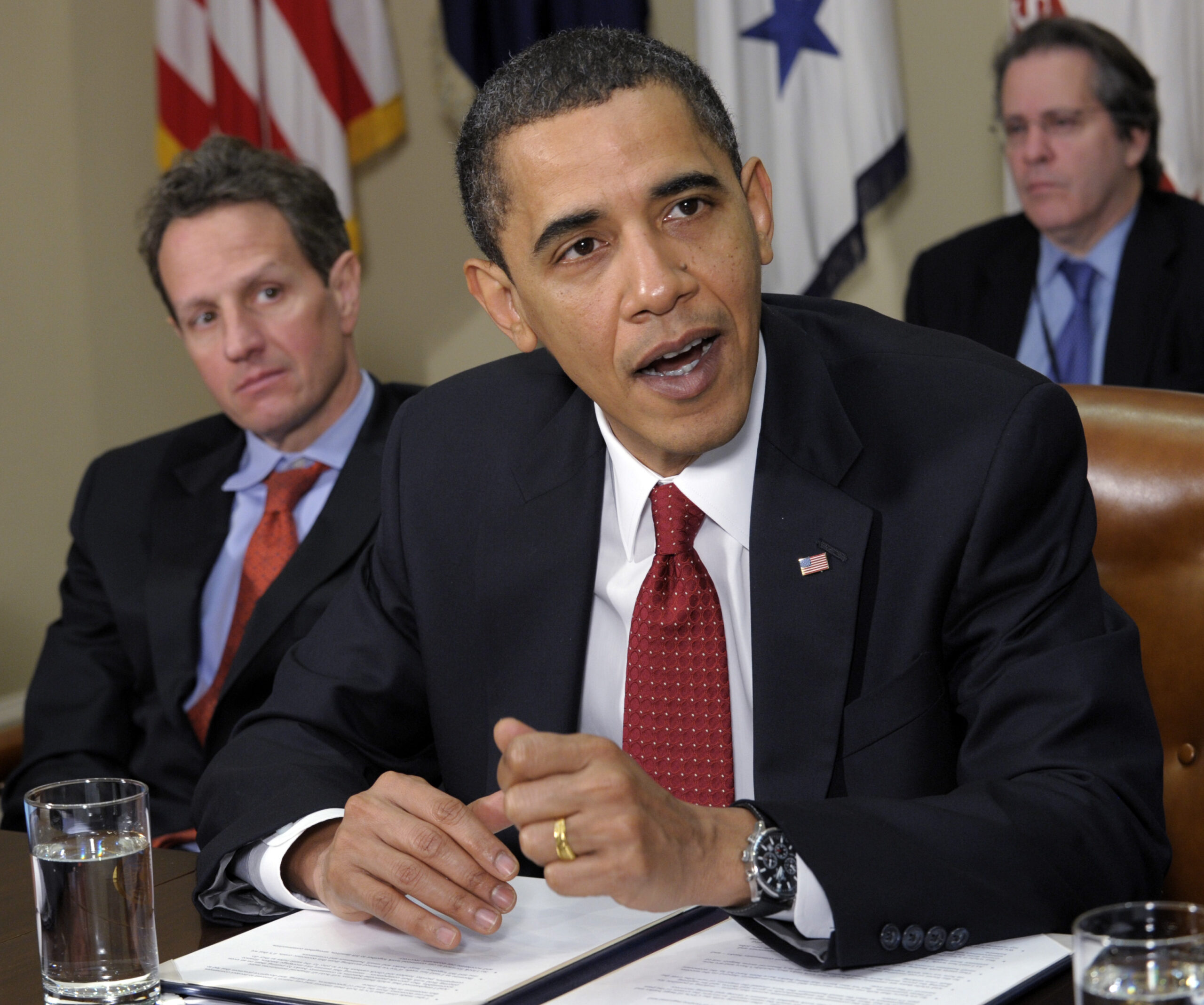 Treasury Secretary Timothy Geithner looks on at left, President Barack Obama makes a statement in the Roosevelt Room of the White House in Washington, Tuesday, Dec.  22, 2009, after meeting with chief executive Officers of small and community banks. (AP Photo/Susan Walsh) (Associated Press)
