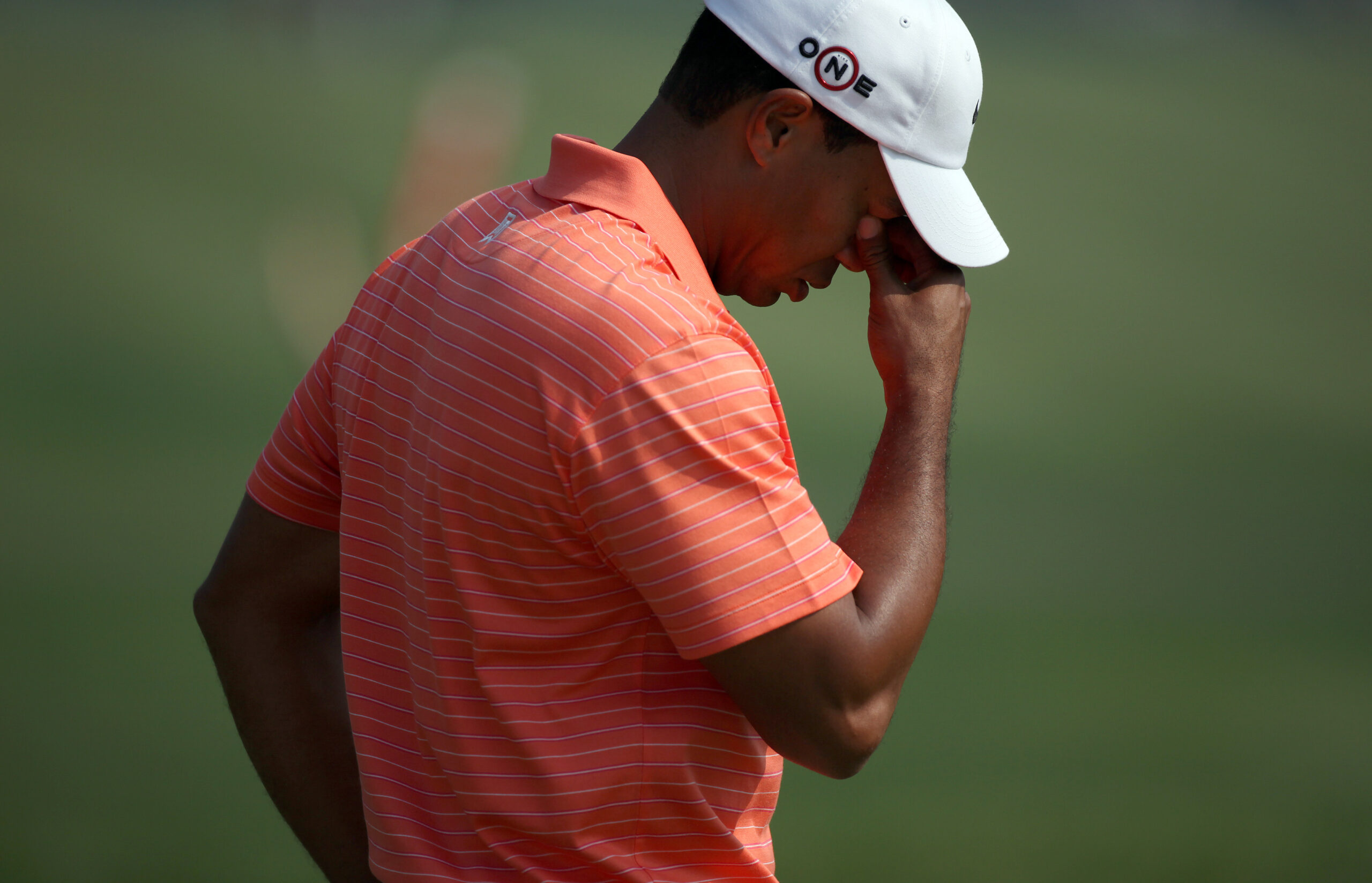 Tiger Woods of the U.S. reacts after taking a shot on the 14th hole during the 2009 HSBC Champions golf tournament in Shanghai November 5, 2009. REUTERS/Nir Elias (CHINA SPORT GOLF) (Reuters)