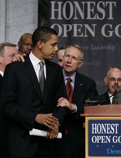 FILE - In this Jan. 18, 2006, file photo Senate Democratic Leader Harry Reid of Nev., center, joined by Sen. Barack Obama, D-Ill., left, prepares to outline the Democrat agenda for reform in the wake of the scandal involving former lobbyist Jack Abramoff, at the Library of Congress in Washington.  Reid apologized Saturday, Jan. 9, 2010, to President Barack Obama  for comments he made about Obama's race during the 2008 presidential bid, which are quoted in a yet-to-be-released book about the campaign titled "Game Change". (AP Photo/J. Scott Applewhite, File) (AP)