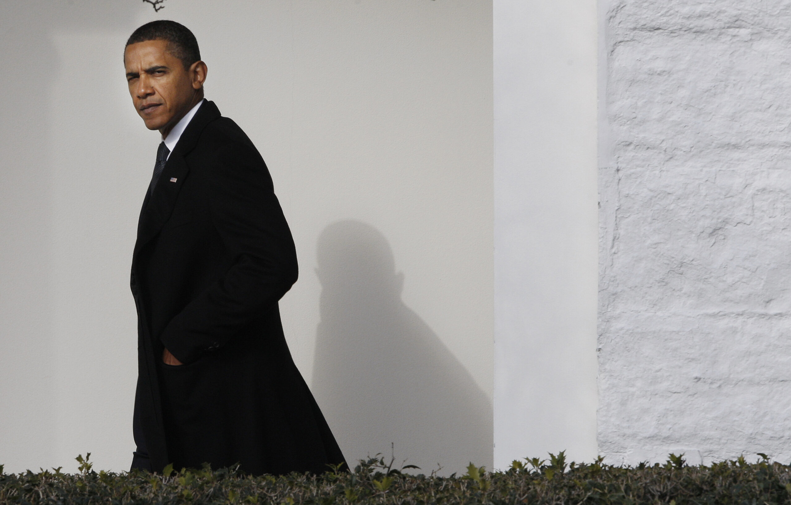 President Barack Obama walks back to the Oval Office of the White House in Washington, Tuesday, Jan. 12, 2010, after traveling to Delaware to attend the funeral services for Jean Biden, mother of Vice President Joe Biden. (AP Photo/Pablo Martinez Monsivais) (Associated Press)