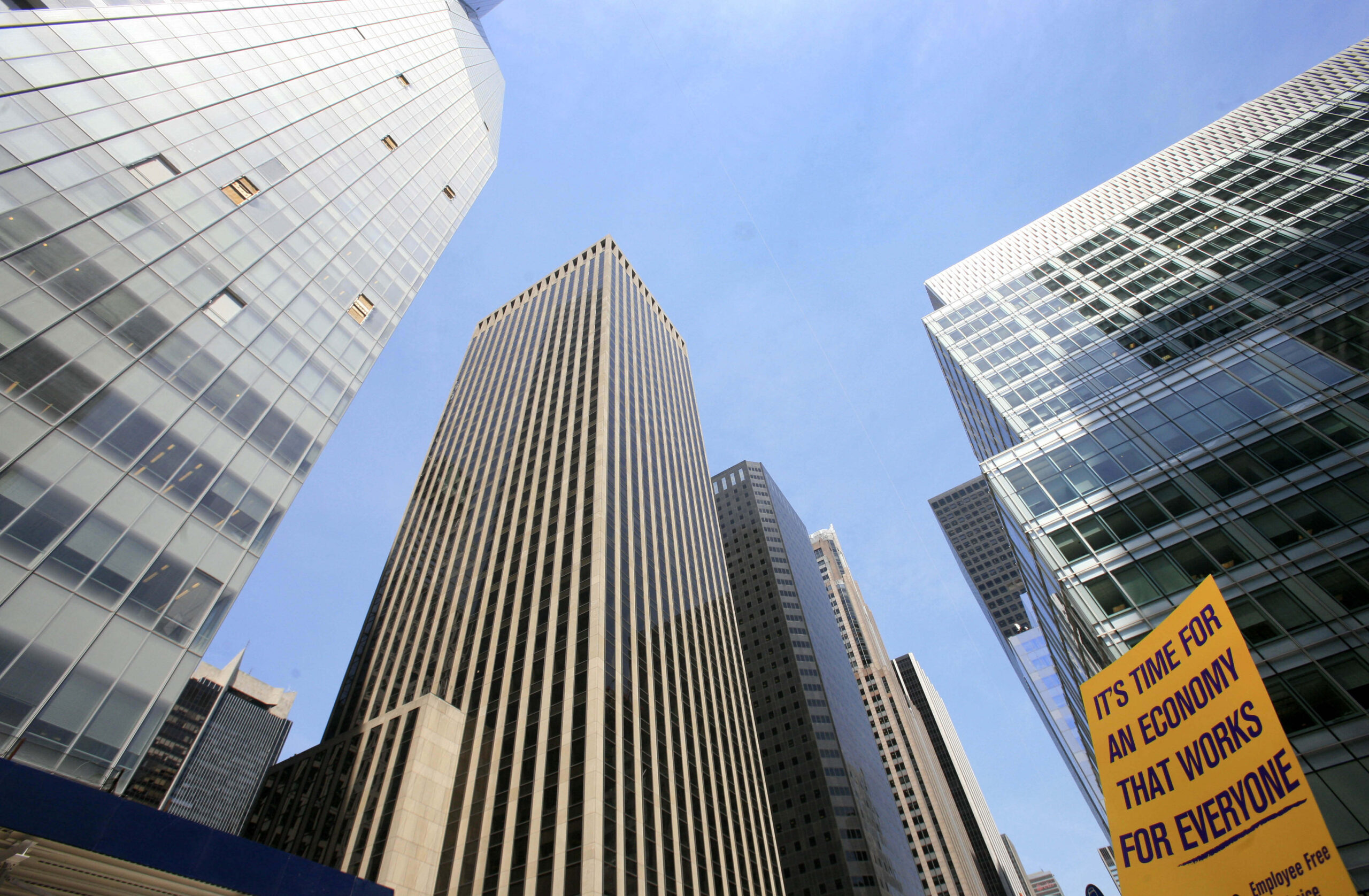 A protest sign is held up outside the Bank of America Tower, left, Tuesday, April 28, 2009 in New York.  Protests are planned nationwide against Bank of America in advance of its shareholders meeting Wednesday. (AP Photo/Mark Lennihan) (Mark Lennihan)