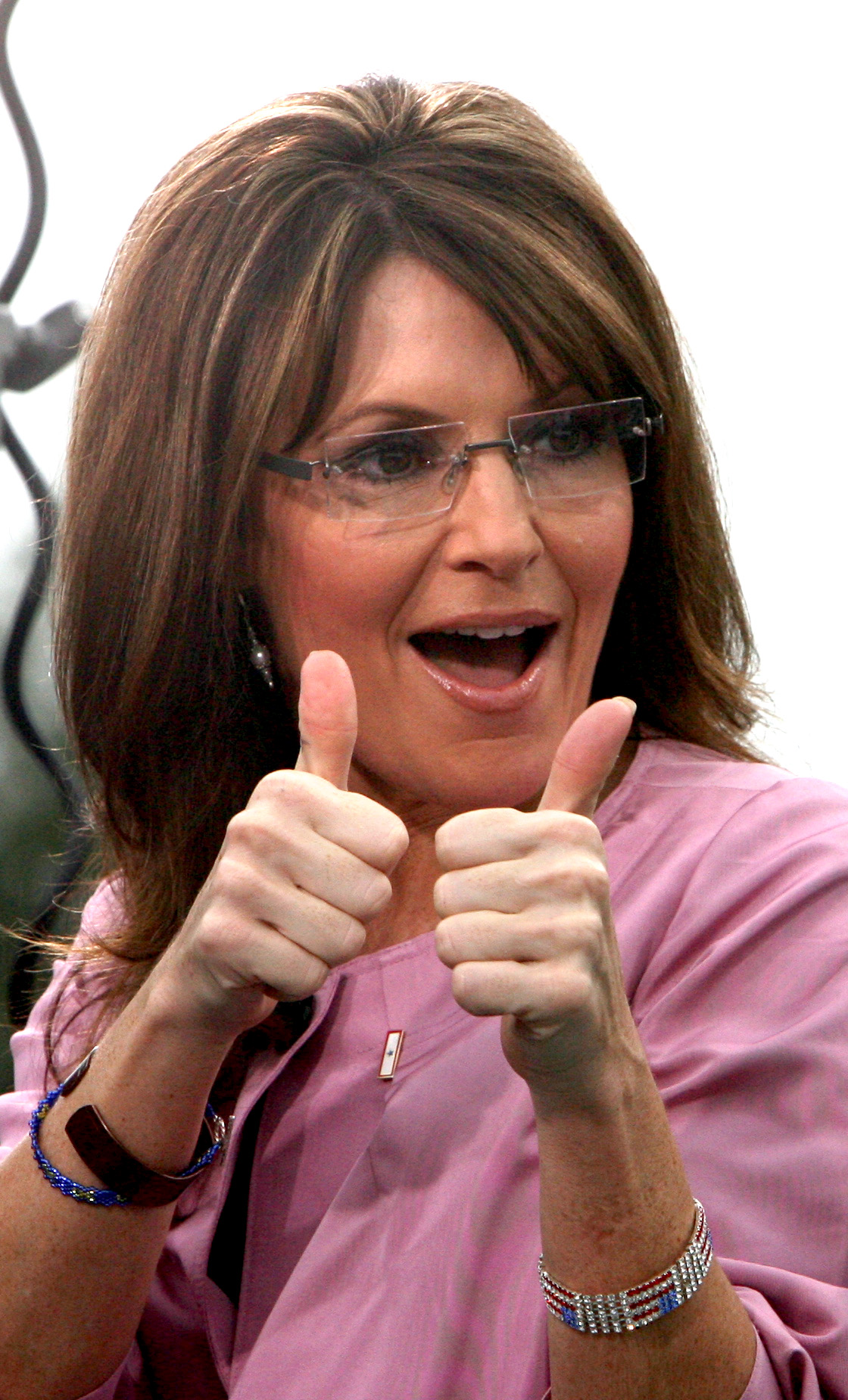 Sarah Palin fans, at the front of the line, cheer as they are the first to be brought into the Barnes & Noble bookstore at Lake Sumter Landing at The Villages, Fla., Tuesday, Nov. 24, 2009. Palin was at the store as a part of her nationwide tour to promote her book, "Going Rogue." She is scheduled to appear in Orlando later in the day. (Joe Burbank/Orlando Sentinel)  newsgate# B58104280Z.1 (Joe Burbank)