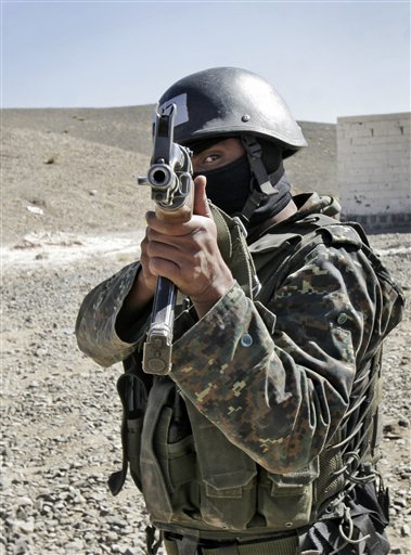 An anti-terrorist unit from the Central Security Forces of the Ministry of Interior trains in the Sarif area on the eastern outskirts of the capital San'a, in Yemen Wednesday, Jan. 6, 2010. Yemeni security forces arrested three suspected al-Qaida militants from a cell that the U.S. has said was linked to a plot against the American or other embassies, the Interior Ministry said Wednesday. (AP Photo) (AP)