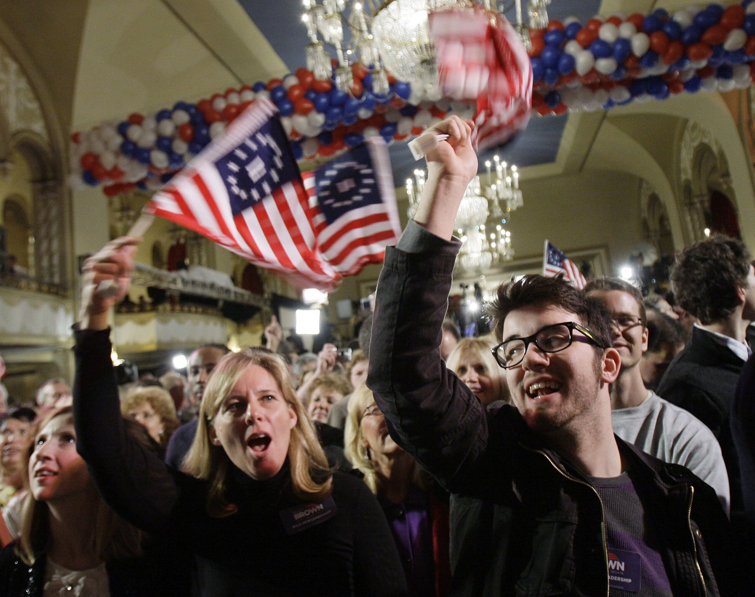 Supporters of Massachusetts State Sen. Scott Brown, R-Wrentham, Barbara Ann O'Neill, left, of Wrentham, Mass., and Jacob Porter, right, of Bucks County, Penn., wave flags before results are announced at Brown's election-night headquarters in Boston, Tuesday, Jan. 19, 2010. Brown is on the ballot of a special election held to fill the U.S. Senate seat left vacant by the death of Sen. Edward Kennedy. He is running against Massachusetts Attorney General Martha Coakley, a Democrat, and Joseph L. Kennedy, a Libertarian running as an independent and not related to the late Sen. Kennedy.  (AP Photo/Elise Amendola) (Elise Amendola)