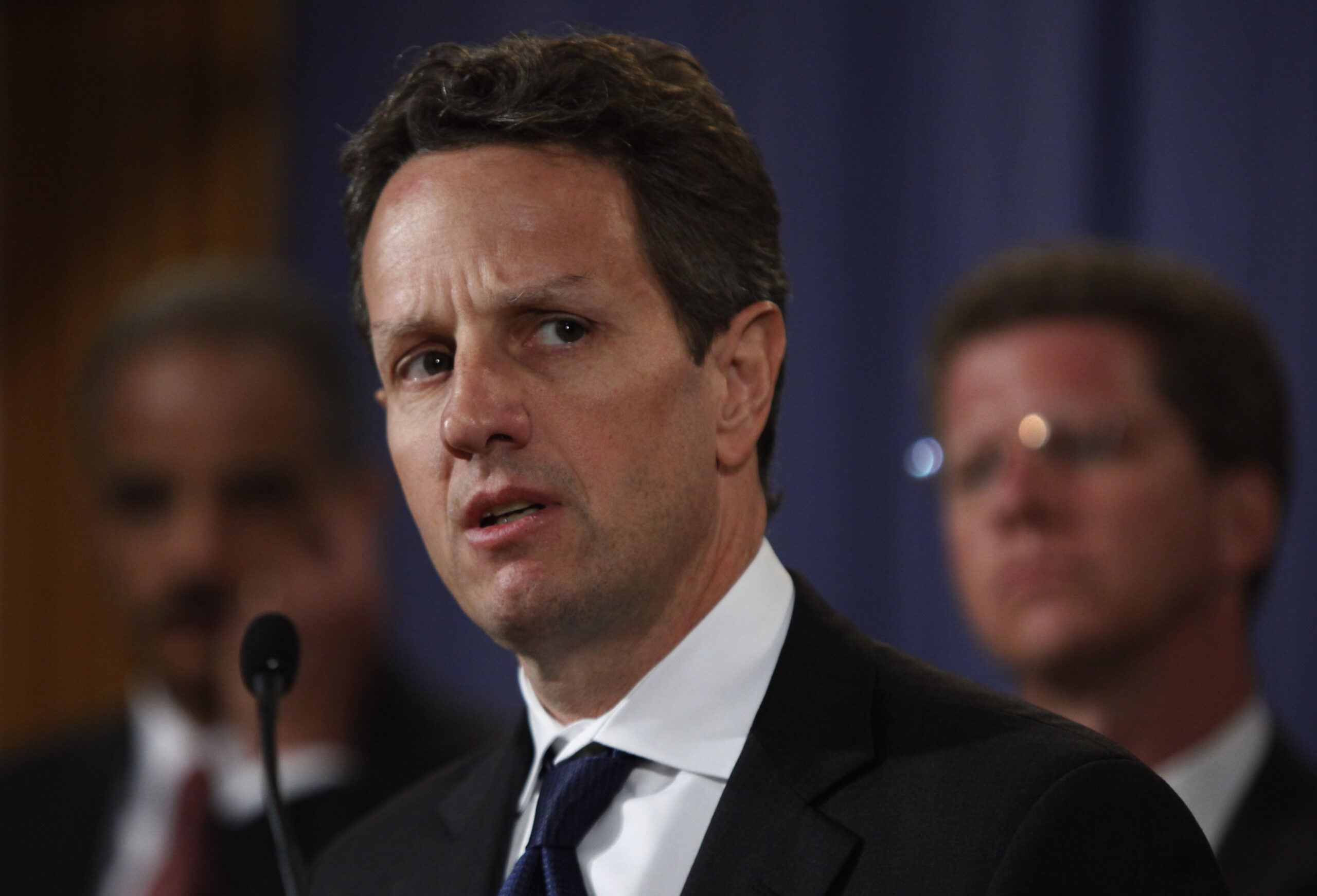 Treasury Secretary Timothy Geithner, flanked by Attorney General Eric Holder, left, and Housing Urban Development Secretary Shaun Donovan, speaks during a news conference on financial fraud efforts, Tuesday, Nov. 17, 2009, at the Justice Department in Washington.   (AP Photo/Manuel Balce Ceneta) (Associated Press)