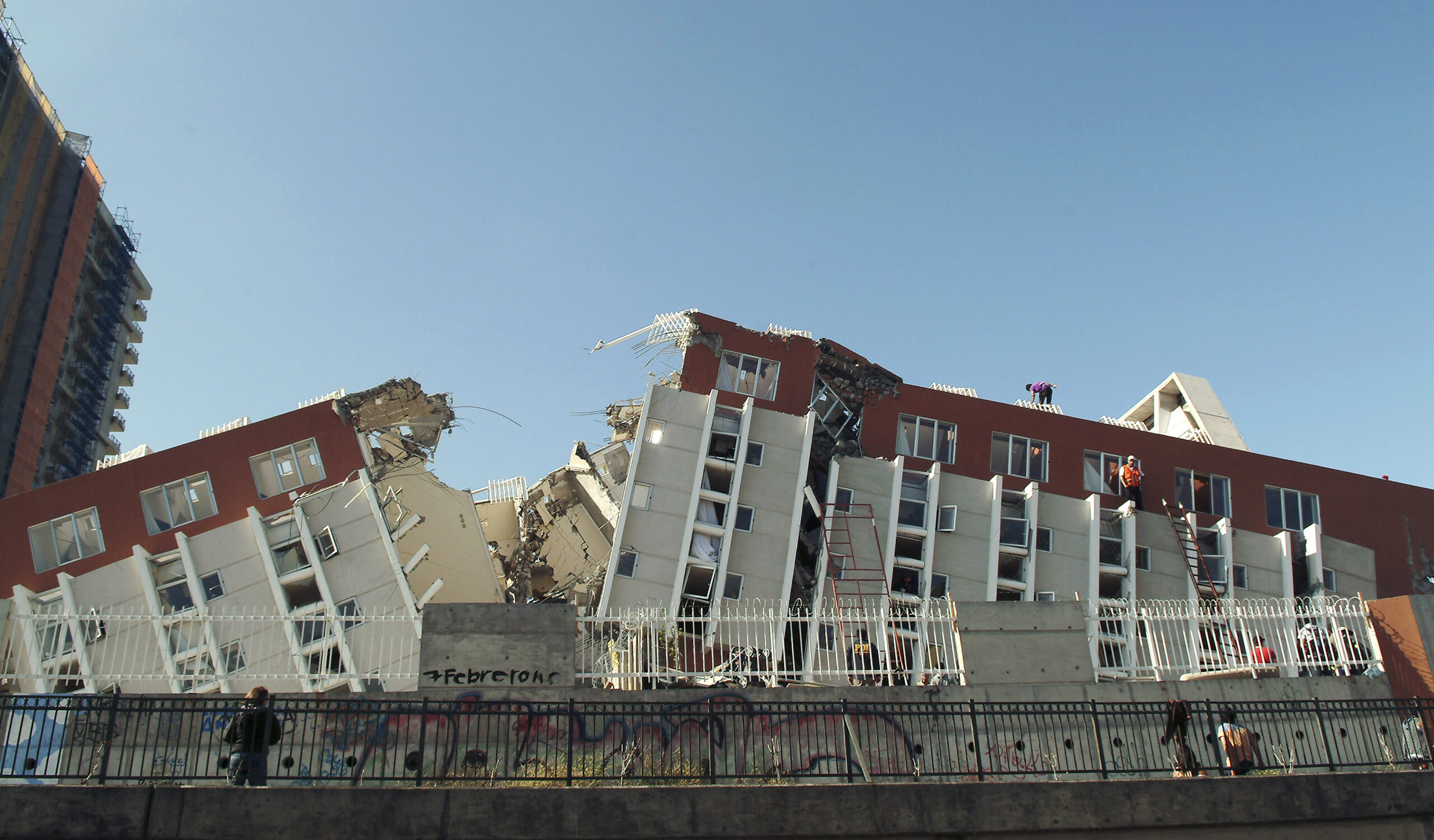 Rescue workers search for victims and survivors after an apartment complex collapsed during an earthquake in Concepcion some 100 km (62 miles) south of the epicenter, February 27, 2010. A huge magnitude-8.8 earthquake struck Chile early on Saturday, knocking down homes and hospitals, and triggering a tsunami that rolled menacingly across the Pacific REUTERS/Jose Luis Saavedra (CHILE - Tags: DISASTER ENVIRONMENT IMAGES OF THE DAY) (Reuters)