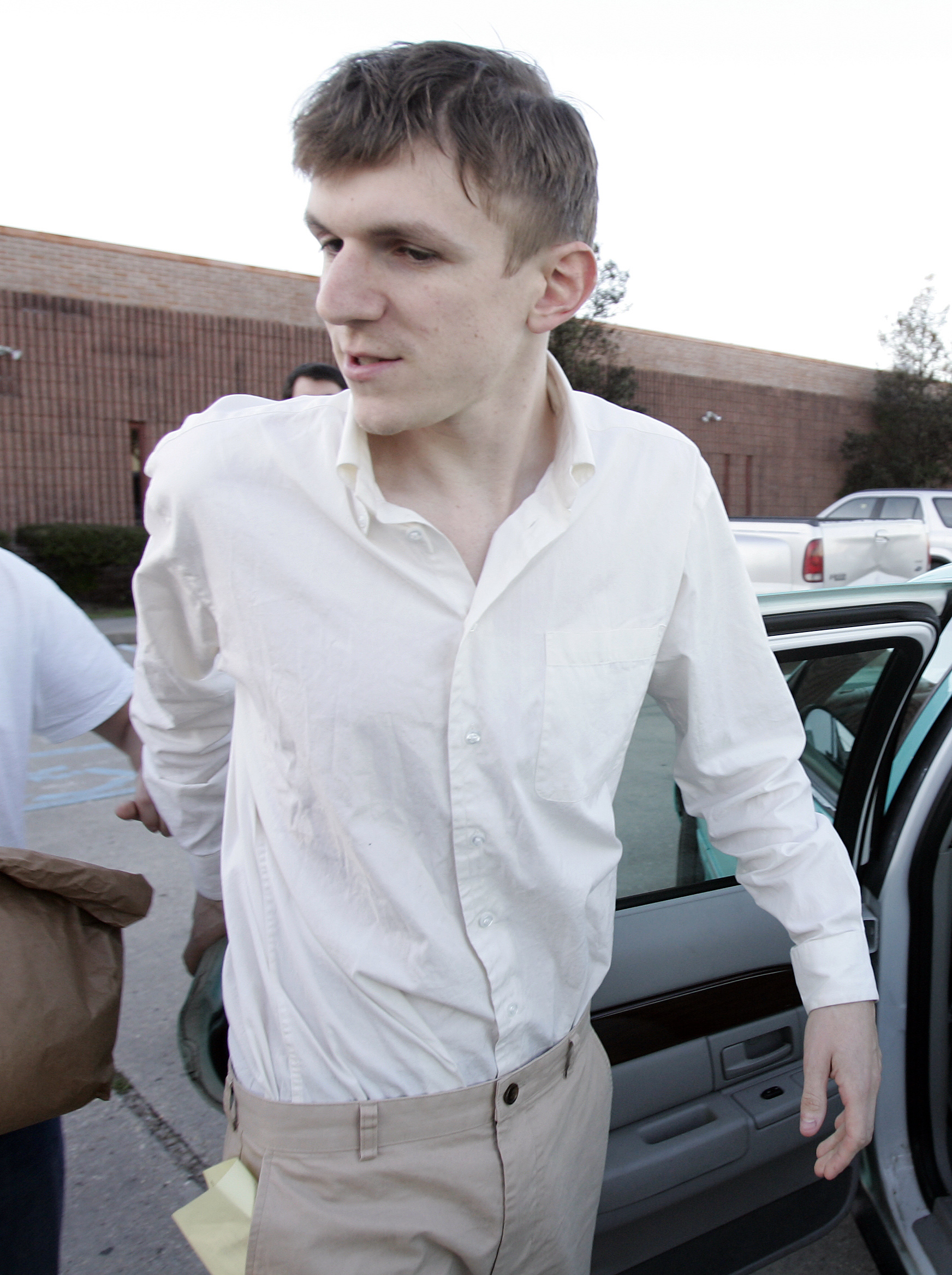 James O'Keefe speaks with the media while getting into a taxi cab after being released from the St. Bernard Parish jail in Chalmette, La., Tuesday, Jan. 26, 2010. O'Keefe, a conservative activist who posed as a pimp to target the community-organizing group ACORN, is one of four people arrested by the FBI and accused of trying to interfere with phones at Sen. Mary Landrieu's office in New Orleans. () (AP Photo/Patrick Semansky)