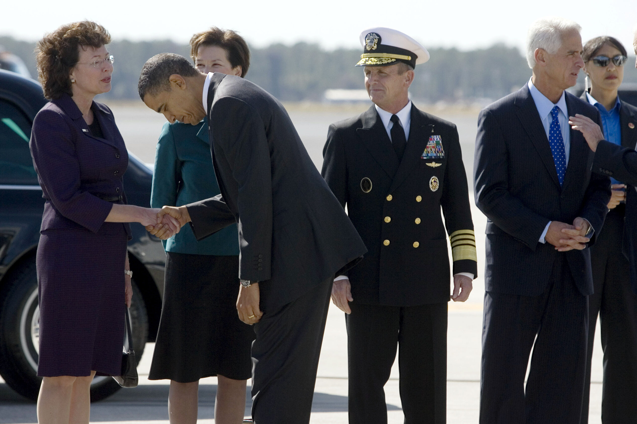 President Barack Obama bows to Tampa Mayor Pam Iorio at MacDill Air Force Base on Thursday, Jan. 28, 2010 in Tampa, Fla. (AP Photo/Edmund Fountain, Pool) (Edmund Fountain)