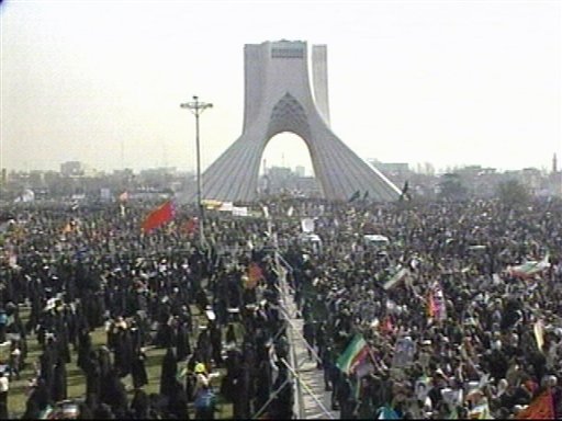 An image made from video provided by Iranian State TV, pro-government demonstrators gather in the central square of Tehran to mark the 31st anniversary of Iran's 1979 Islamic Revolution Thursday Feb. 10, 2010.  (AP Photo/IRIB via APTN) (AP)