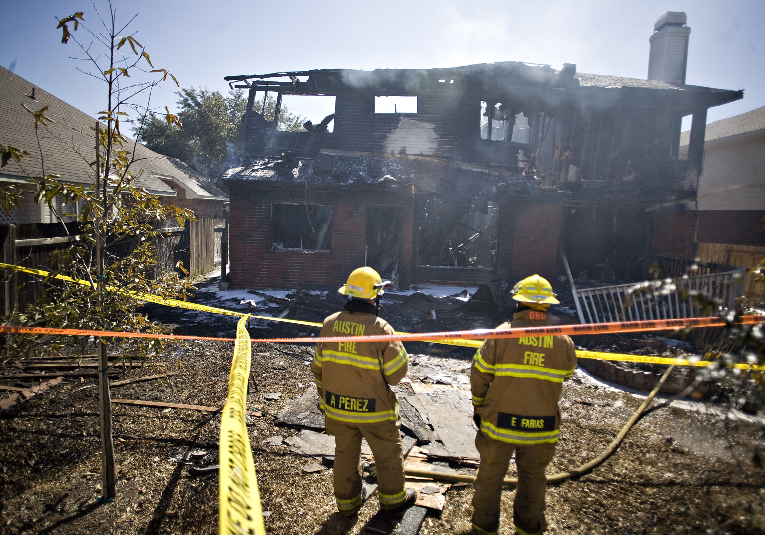 Two firemen are seen at the home belonging to Joseph Stack, after Stack apparently set  it on fire according to two law enforcement officials, Thursday morning on Feb. 18, 2010 in Austin, Texas. Stack, a software engineer furious with the Internal Revenue Service plowed his small plane into an office building housing nearly 200 federal tax employees on Thursday, officials said, setting off a raging fire that sent workers fleeing as thick plumes of black smoke poured into the air. (AP Photo/ Thao Nguyen) (AP)