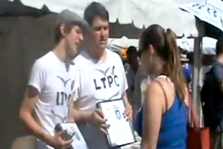 O'Keefe and Wetmore try to convince people to adopt a Guantanamo detainee in a still from their "Love Thy Prisoner Campaign" video.