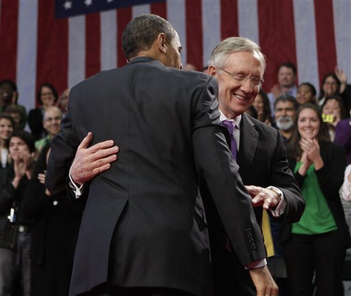 President Barack Obama embraces Senate Majority Leader Harry Reid of Nev. during a town hall meeting at Green Valley High School in Henderson, Nev., Friday, Feb. 19, 2010. (AP Photo/Pablo Martinez Monsivais) (AP)