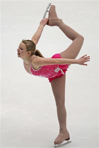 ** CORRECTS SPELLING TO RACHAEL, INSTEAD OF RACHEL ** FILE - In this Oct. 30, 2009, file photo, United States' Rachael Flatt skates her ladies short program during Figure Skating Cup of China 2009 competition in Beijing, China. The big tricks--quadruple jumps for the guys, triple-triple combinations for the women--can produce medal-winning scores. But do them without intricate footwork, fine edge quality and beautiful spins, and a performance seems hollow, little more than a blueprint. (AP Photo/Elizabeth Dalziel, File) (AP)