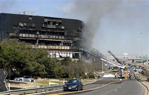 Smoke billows from a seven-story building after a small private plane crashed into the building  in Austin, Texas on Thursday Feb. 18, 2010. (AP Photo/Austin American-Statesman, Jay Janner/) MANDATORY CREDIT. NO MAGS, NO SALES, NO TV (AP)