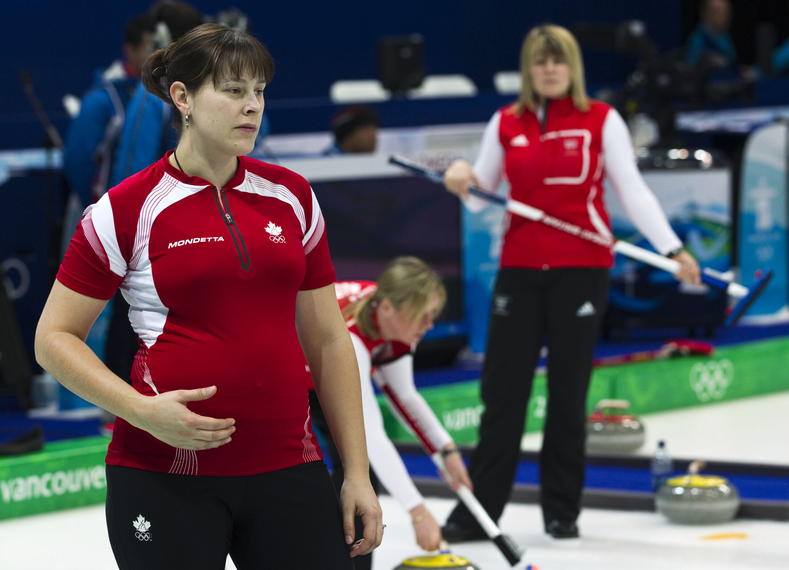 Team Canada alternate Kristie Moore, left, is shown at practice at the Olympic Centre on Monday, Feb. 15, 2010 during the 2010 Vancouver Olympic Winter Games in Vancouver.  Moore is five months pregnant. (AP Photo/The Canadian Press, Nathan Denette) (Associated Press)
