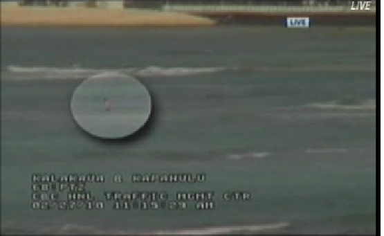 A man is videotaped wading into Waikiki beach by the <a href="http://www.salon.com/news/story/index.html?story=/news/2010/02/27/khon2_hawaii_news">local CBS affiliate</a> amid tsunami warnings.