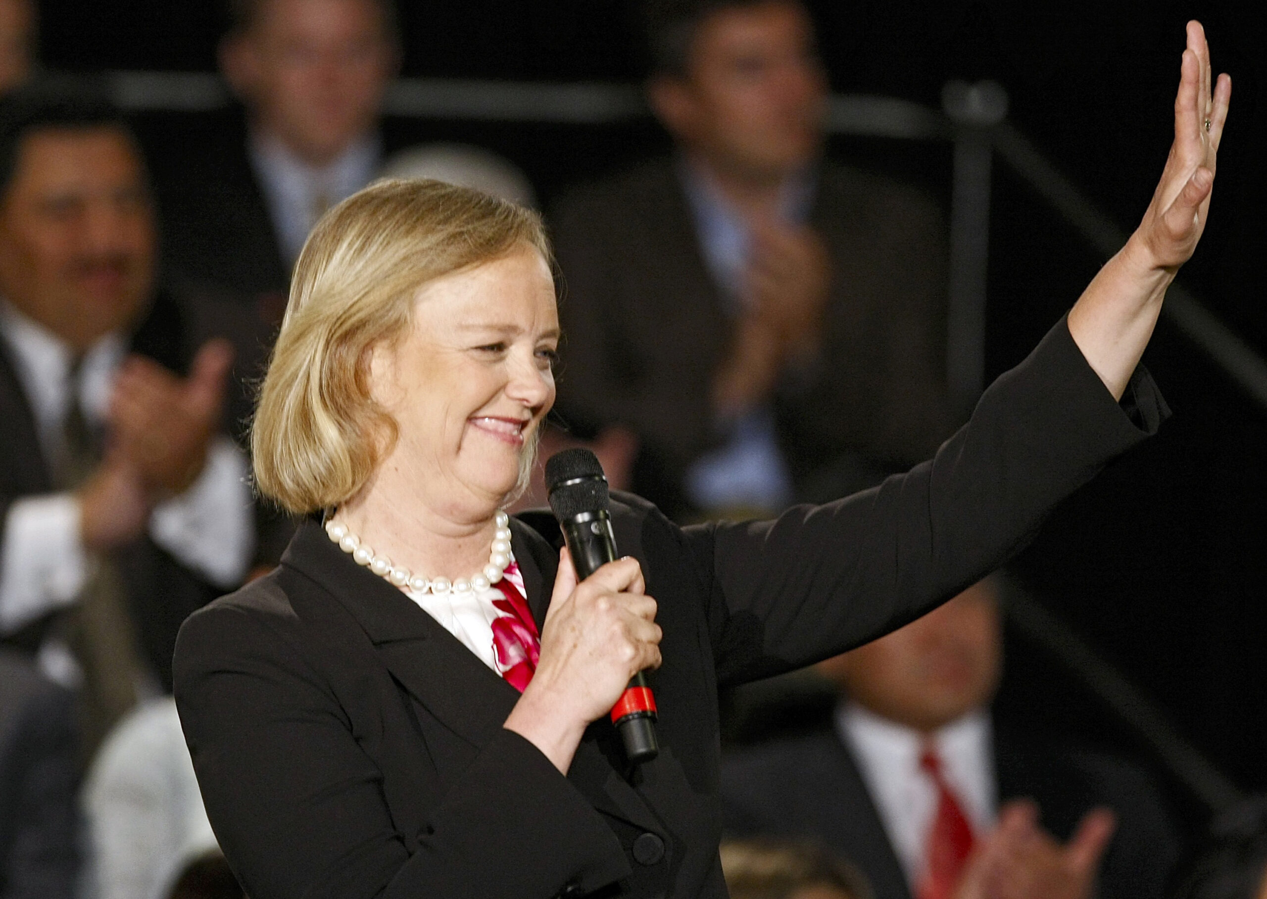 Former eBay chief executive Meg Whitman, Republican gubernatorial hopeful, left, smiles during a town hall meeting Friday May 29, 2009 at The Marconi Automotive Museum in Tustin, Calif. (AP Photo/Damian Dovarganes) (Damian Dovarganes)