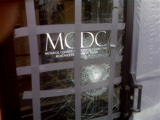 This picture provided on Wednesday, March 24, 2010 by the Monroe County Democratic Committee in Rochester, N.Y. shows damage to their office after a glass door was struck with a brick with a note reading "Exremism in Defense of Liberty Is no Vice" sometime from late Saturday, March 20, 2010 or Sunday, March 21, 2010. Bricks have been hurled through Democrats' windows, a propane line was cut at the home of a congressman's brother and lawmakers who voted for a federal health care bill have received phone threats in the days before and after passage of the sweeping legislation. (AP Photo/Monroe County Democratic Committee) (AP)