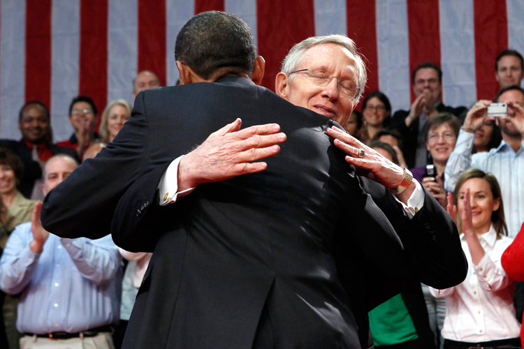 President Obama gets a hug from Senate Majority Leader Harry Reid at a town hall style meeting in Henderson, Nevada on February 19.