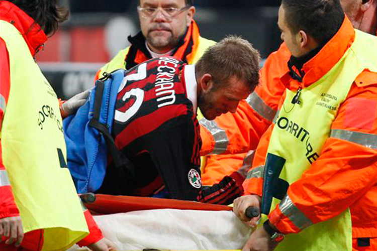 David Beckham leaves the pitch after being injured during a match on Sunday.