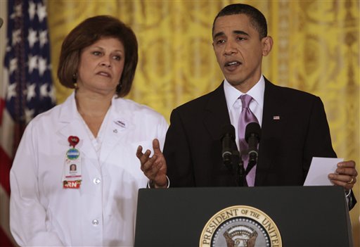 President Barack Obama, accompanied by registered nurse Barbara Crane, speaks about health care reform, Wednesday, March 3, 2010, in the East Room of the White House in Washington. (AP Photo/Charles Dharapak) (AP)
